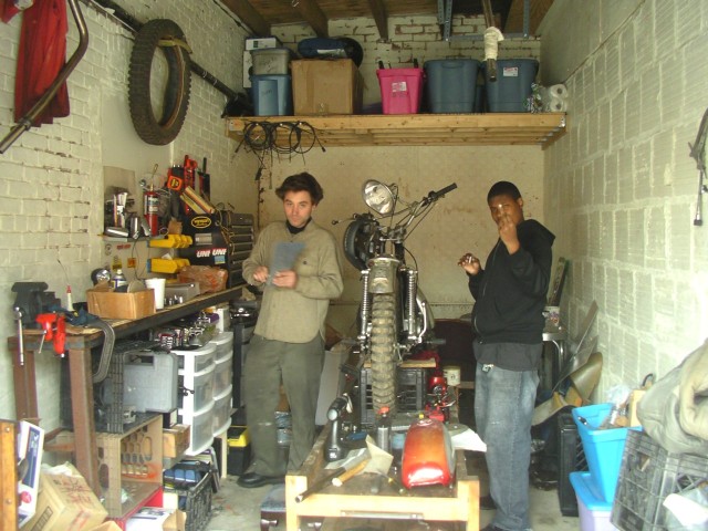 Sayre and the prodigy Irving, working on the 1969 Kawasaki C2tr