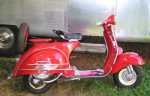 I used to have this; shifting was too stiff for me.  Don't like those little wheels either