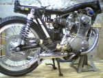 This is what she looks like now, the rear disc conversion, shouldered rim, dirt track hubs, and works shocks. The rest is a mess.
